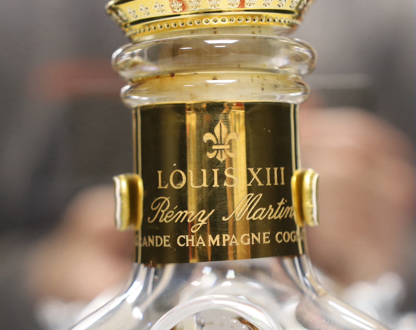 An empty Baccarat Remy Martin Louis XIII decanter, in display case with booklet